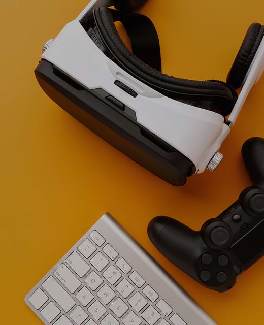 VR headset, game controller, and keyboard symbolizing digital gamification for eLearning